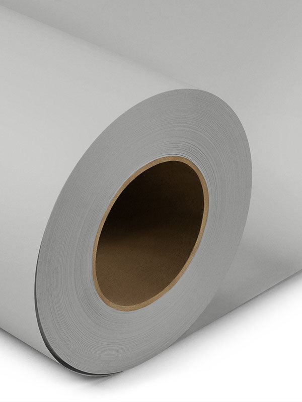 Close-up of light gray seamless photography backdrop paper roll, ideal for studio photography and video shoots.