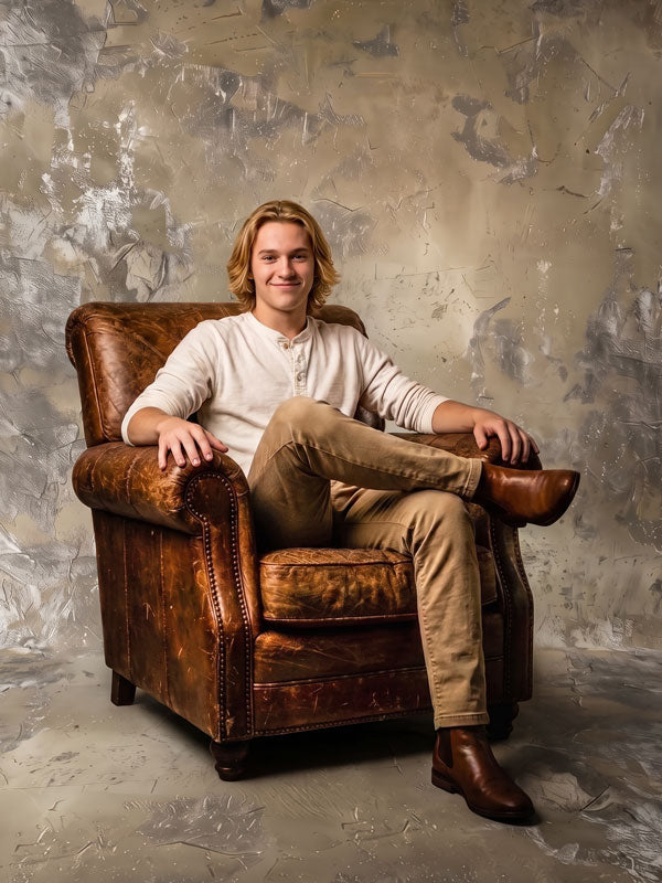 Limestone limestone gray texture photography backdrop shown behind a young man seated in a leather armchair CP-9001