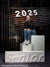 Senior girl seated on posing blocks with white magnetic numbers "2025" on an industrial backdrop. "Senior" displayed on a horizontal block.
