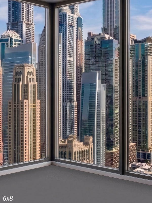 Modern room corner with floor-to-ceiling windows over a sunlit cluster of skyscrapers under a blue sky, a city view photography backdrop.