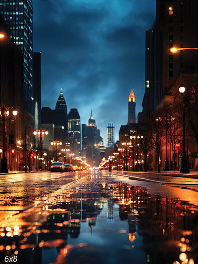 Nighttime Cityscape Photography Backdrop - A city street at night with a lit skyline and reflections on wet pavement, used as a photography backdrop for urban-themed shoots.