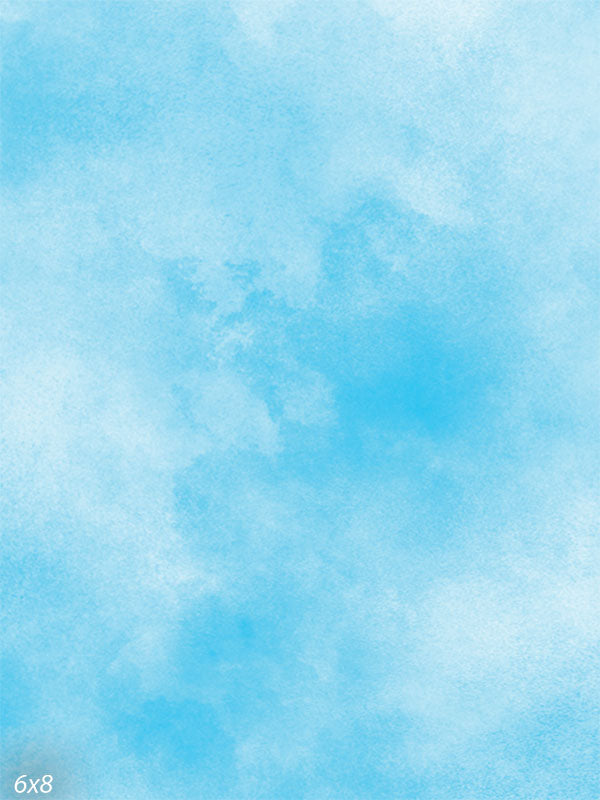 Hand-painted blue backdrop featuring soft, sky-inspired textures, ideal for portraits and creative editorial photography.