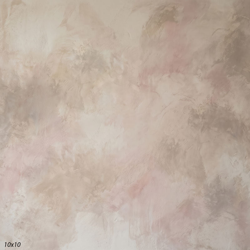 Printed studio background showing a painterly mottled oat greige texture with a lighter center that deepens toward the edges.