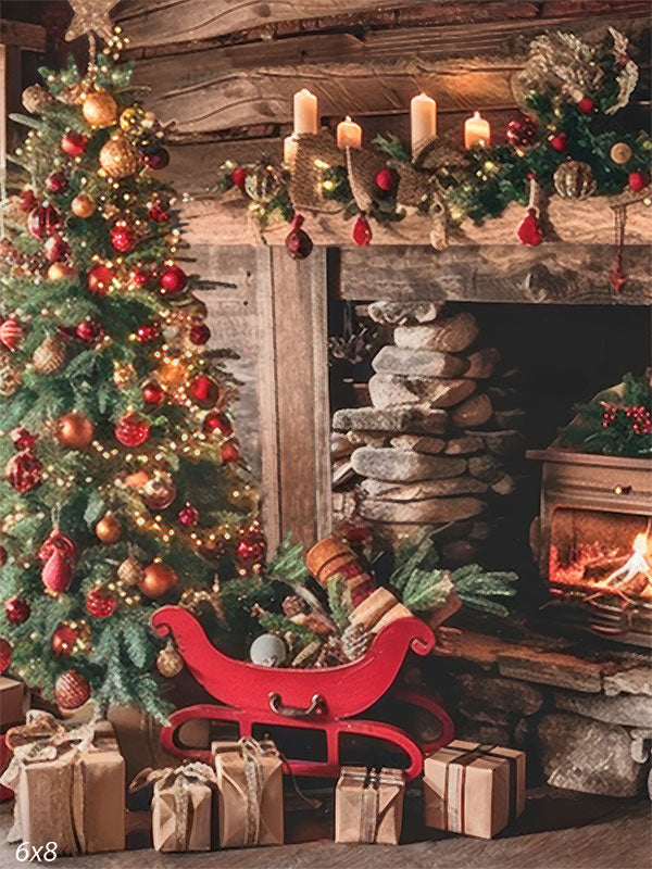 Painted-style Christmas photography backdrop featuring a rustic log cabin fireplace, red sleigh, decorated Christmas tree, glowing candles, and wrapped gifts—ideal for cozy, vintage-inspired holiday portraits.
