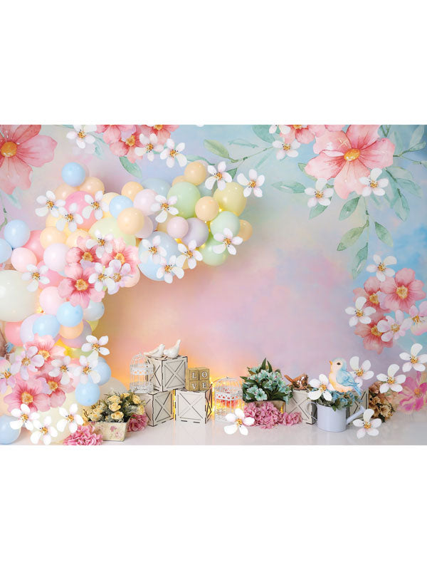 Pastel Floral Balloon Wonderland Backdrop - Spring-themed backdrop with pastel balloons, pink flowers, white daisies, wooden crates, and bird cages, perfect for cake smash and children's photoshoots.