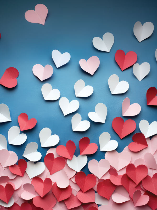 Pastel Heart Confetti Photography Backdrop - Photography backdrop featuring paper hearts in shades of pink, white, and red scattered across a soft blue background.