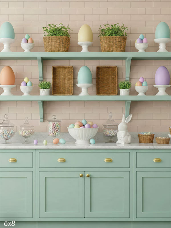 A pastel kitchen shelf scene with decorative eggs, woven baskets, ceramic rabbits, and glass jars on a mint green cabinet. Printed photography backdrop for spring or Easter settings.
