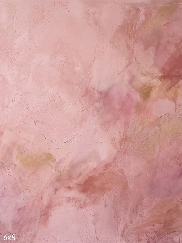Printed photography backdrop showing warm peach and blush, a soft mottled painterly texture with gentle tonal movement.