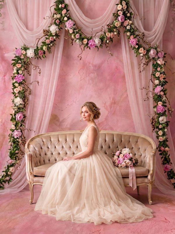 Peach Blush peach texture photography backdrop shown behind a bride on a settee framed by a floral arch CP-9010