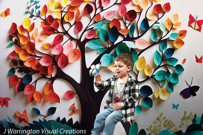 Full scene of colorful butterfly tree backdrop with happy boy and whimsical leaves arranged like a celebration.
