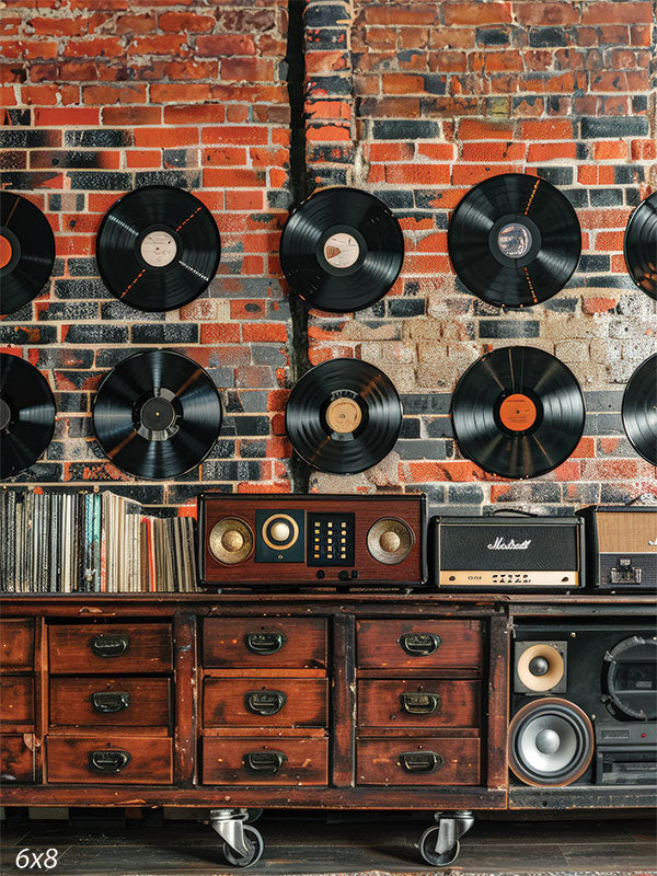 Retro Vinyl Record Wall Photography Backdrop - Vintage brick wall with mounted vinyl records and rustic audio equipment, ideal for music-themed photography and retro-inspired shoots.