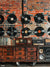 Retro Vinyl Record Wall Photography Backdrop - Vintage brick wall with mounted vinyl records and rustic audio equipment, ideal for music-themed photography and retro-inspired shoots.