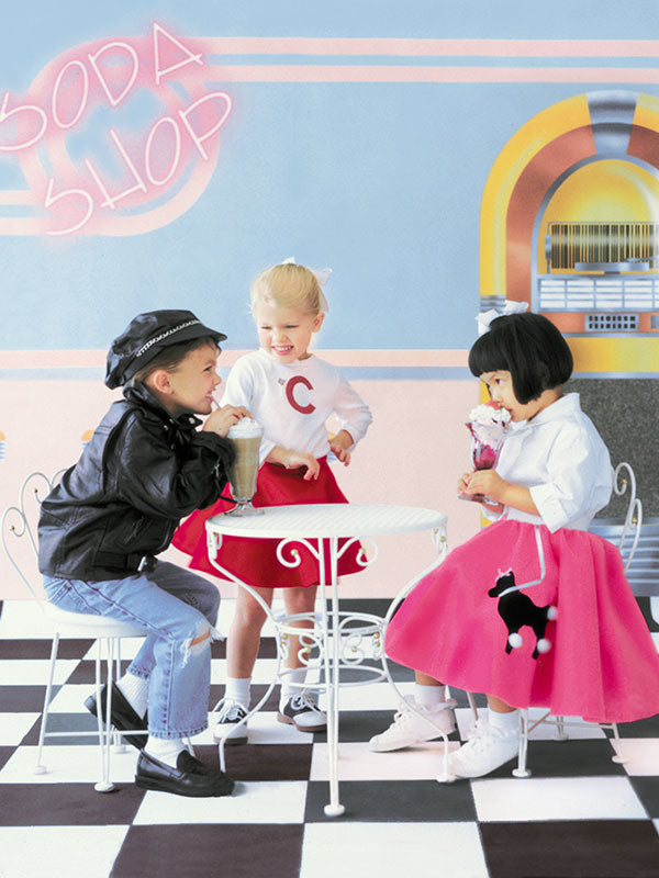 A nostalgic 1950s soda shop backdrop featuring chrome barstools, pastel pink and teal walls, and a jukebox, ideal for rockabilly and pin-up photography sessions.