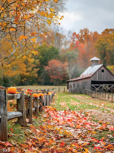 Rustic Autumn Barn Photography Backdrop - Photography backdrop featuring a rustic barn with a wooden fence lined with pumpkins, surrounded by autumn foliage.