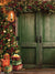 Rustic Christmas Barn Door Photography Backdrop - Rustic Christmas scene with a decorated tree, green barn door, garlands, and presents, ideal for holiday photography.