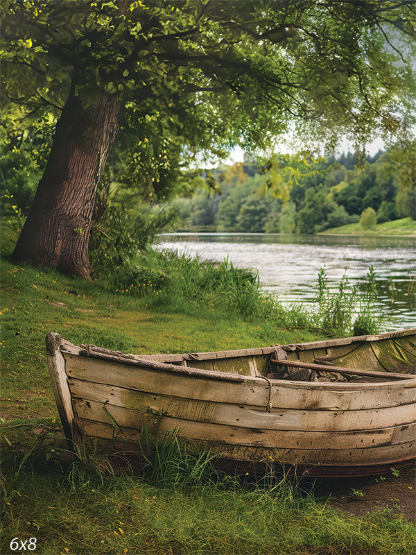 Rustic Rowboat by the Lakeside Photography Backdrop - Photography backdrop of a rustic rowboat resting by a lakeside, surrounded by lush greenery and trees.