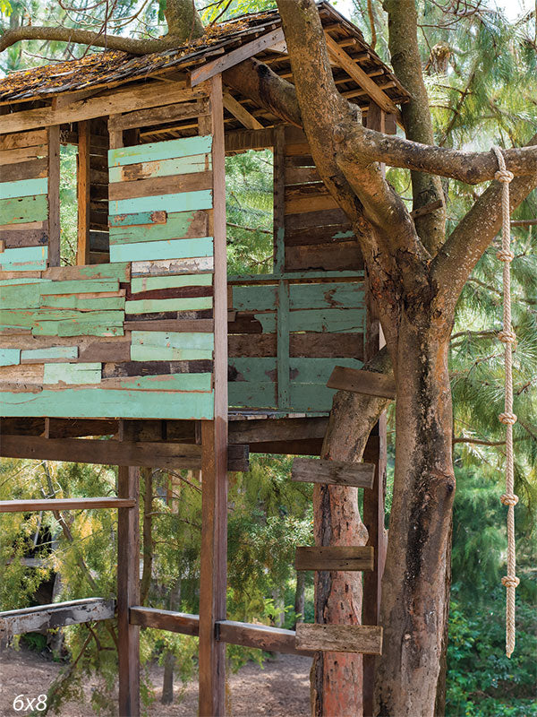 Rustic Treehouse Photography Backdrop - Rustic treehouse photography backdrop featuring a weathered wooden treehouse nestled among lush green trees.