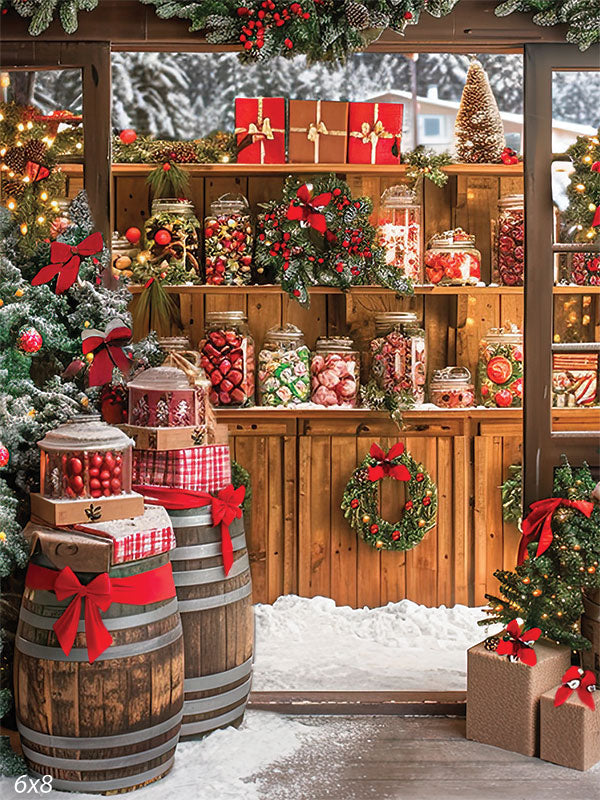 Festive rustic Christmas candy shop photography backdrop featuring a wooden booth decorated with jars of holiday treats, gift boxes, wreaths, and snow-covered trees—ideal for seasonal mini sessions and studio portraits.
