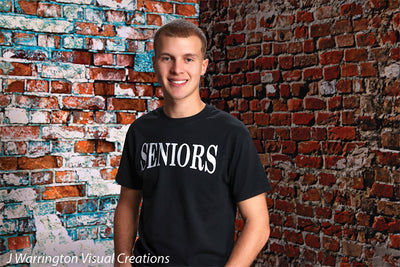 Warm-toned distressed brick professional photo backdrop.