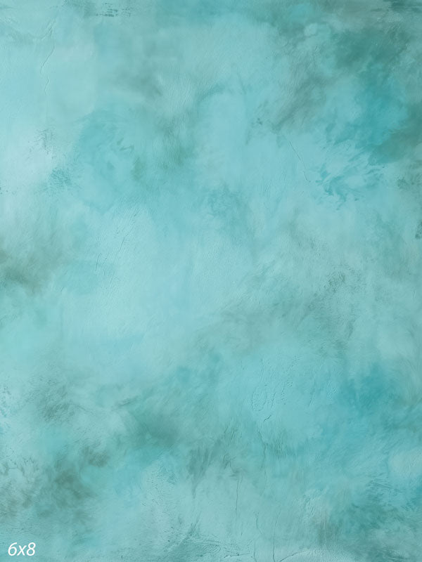 Printed photography backdrop showing soft seafoam aqua, a soft mottled painterly texture with gentle tonal movement.