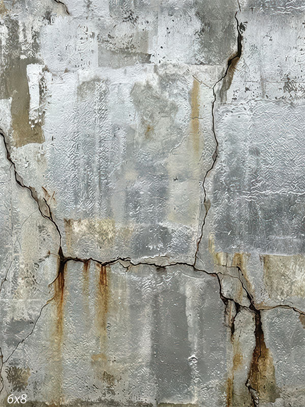 Silver-gray industrial photography backdrop showing cracked concrete texture with weathered plaster and subtle rust staining across the surface.