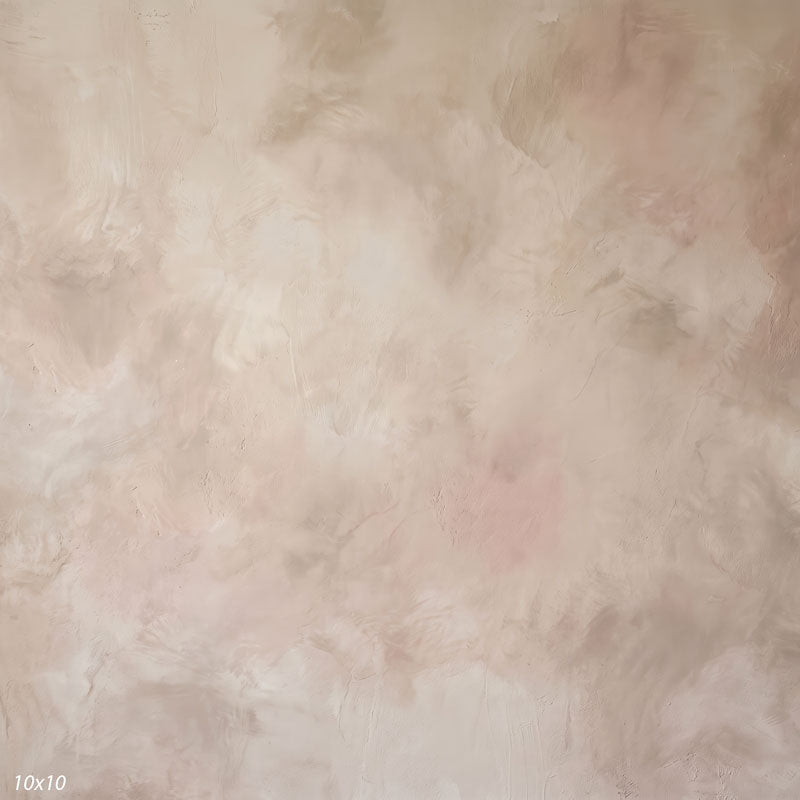 Printed studio background showing a painterly mottled almond beige texture with a lighter center that deepens toward the edges.
