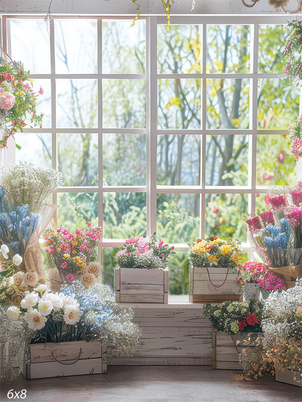 Spring flower shop background with colorful floral arrangements by a large window.