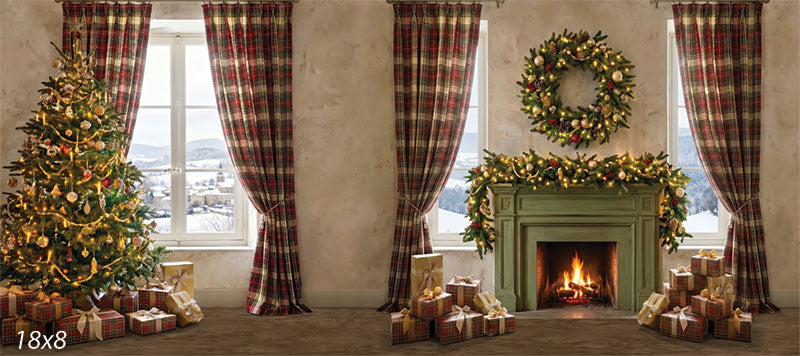 Printed photography backdrop showing a cozy plaid Christmas living room corner with a decorated Christmas tree, a green fireplace topped by a lit wreath and garland, red tartan curtains, and snowy window views.