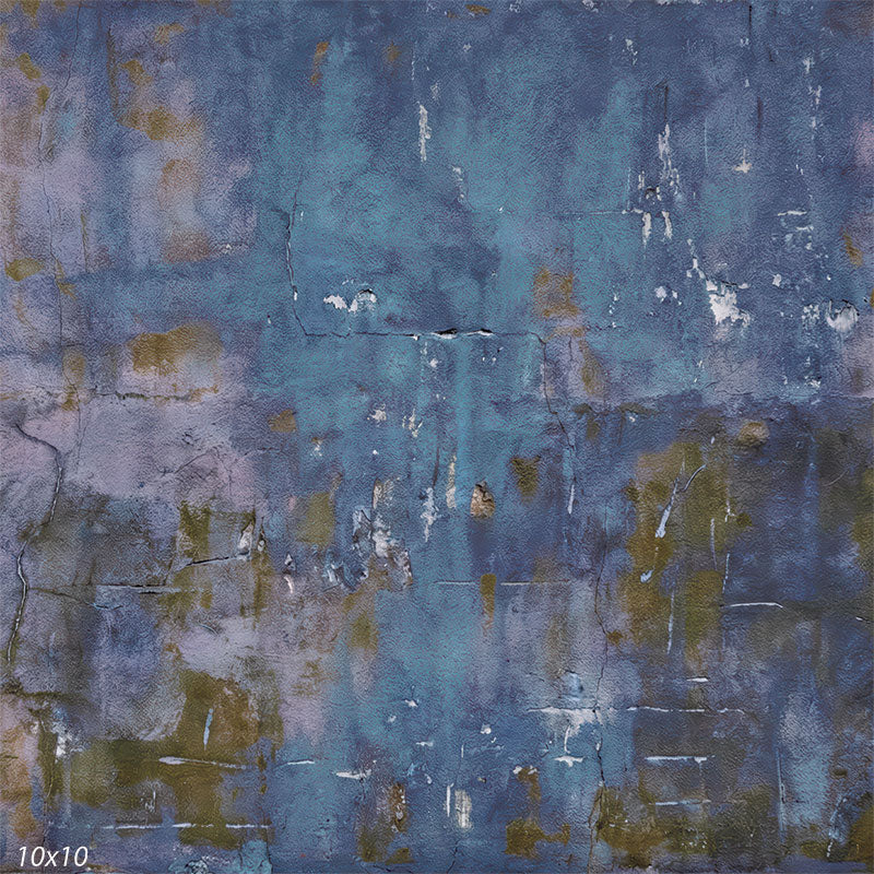 This studio background features an abstract blue painted wall with distressed plaster texture, soft tonal variation, and a matte, non-reflective appearance.