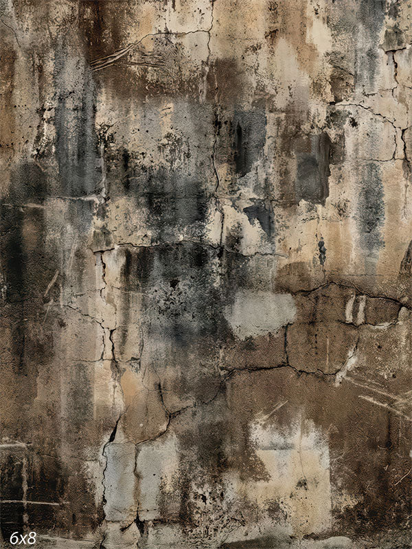 A photography backdrop showing a distressed plaster wall with charcoal and black staining, warm beige and ivory breaks, and visible cracks for studio portraits.