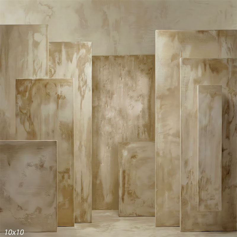 Studio background showing warm beige plaster-style panels at varying depths with a continuous floor and wall for portrait photography.