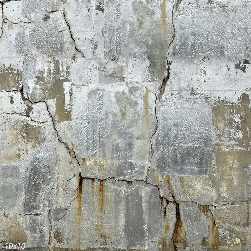 Textured studio background depicting a distressed concrete wall with layered gray tones, visible fractures, and matte industrial surface detail.