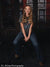Red brick urban backdrop for senior portraits featuring industrial window architecture and studio-style setup.