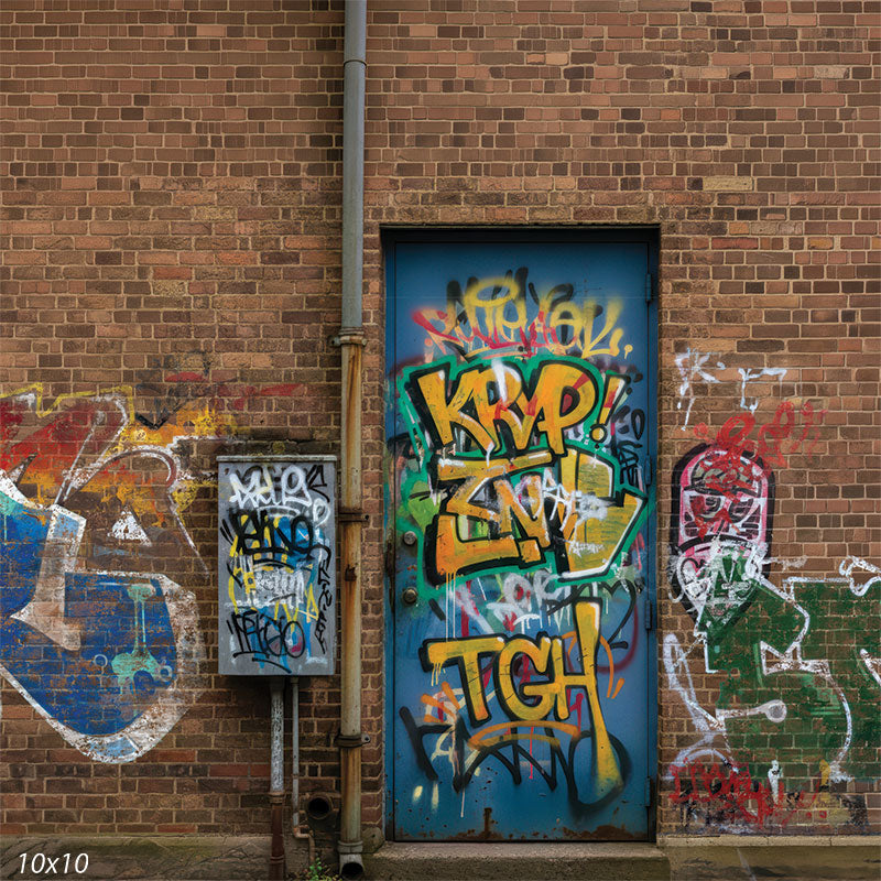 Printed studio background featuring a centered graffiti-covered metal door set into a warm brick wall with surrounding tags and utility piping. The flat wall composition supports urban portrait styling behind a subject.