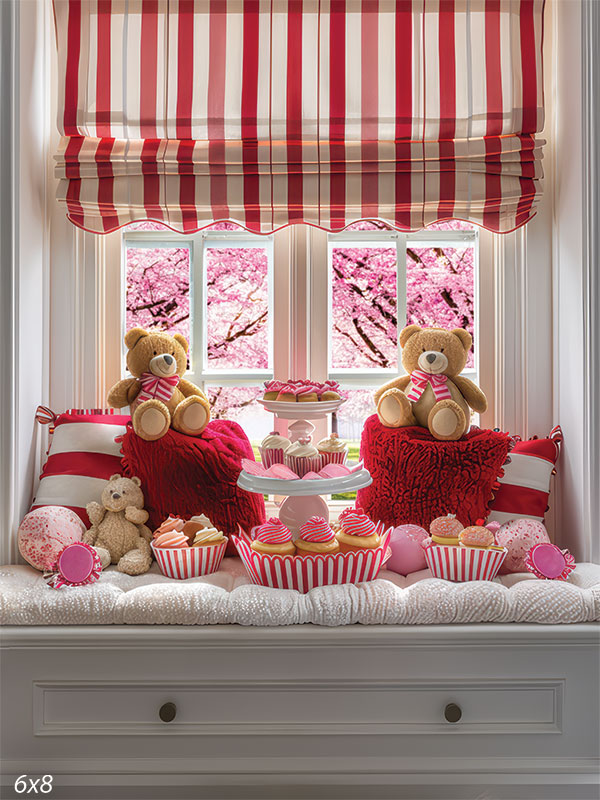 Valentine-themed backdrop featuring a window seat decorated with red and white striped cushions, teddy bears, and cupcakes.