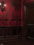 Victorian Gothic Sconce and Red Damask Photography Backdrop - Victorian gothic backdrop with dark wood paneling, rich red damask wallpaper, and an ornate wall sconce for atmospheric photography.