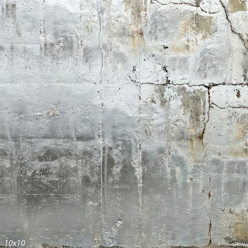 Industrial studio background with pale gray concrete-and-plaster texture, scattered stains, and visible cracks that read as an aged wall surface.