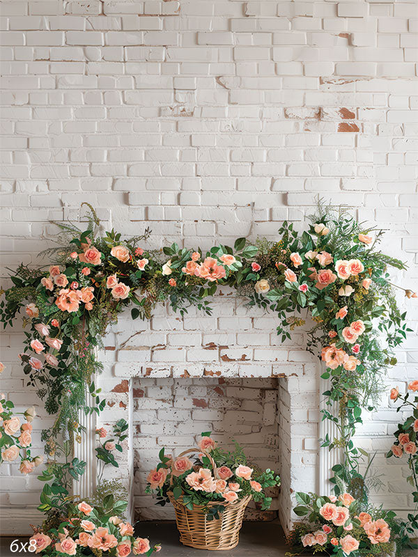 Rustic white brick fireplace adorned with blush floral garland and greenery for Easter and spring-themed portraits.