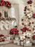 Holiday photography backdrop featuring a bright white fireplace with festive stockings, wrapped gifts, and a large white Christmas tree adorned with red and gold ornaments.