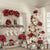 Studio backdrop with a flocked Christmas tree decorated in red, white, and black ornaments next to a cozy white fireplace and holiday gifts—ideal for seasonal portraits.