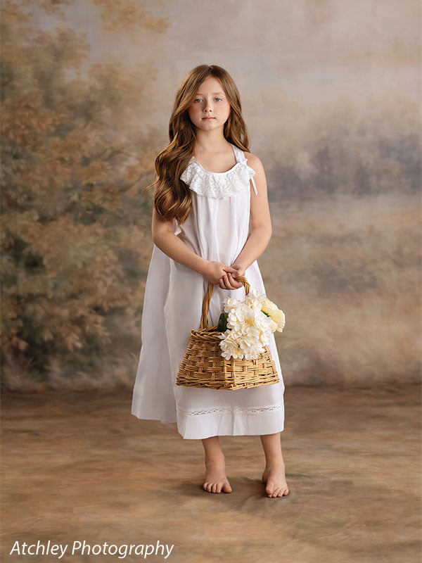 Ansel soft misty meadow with trees photography backdrop shown with a girl in a white nightgown holding a basket of white flowers CP-8845