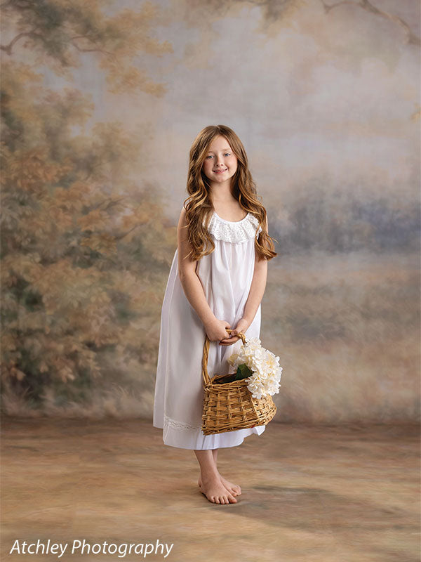 Ansel soft misty meadow with trees photography backdrop shown with a girl in a white nightgown smiling with a basket of white flowers CP-8845