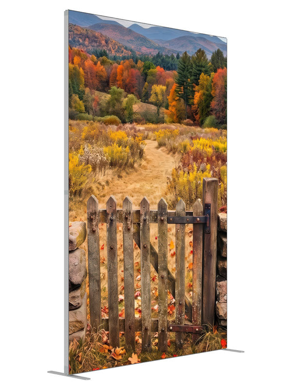 Weathered wooden gate opening to a golden autumn mountain meadow with a blazing tree line, 5ft photography backdrop panel for Denny StudioEdge silicone edge frame, angled view