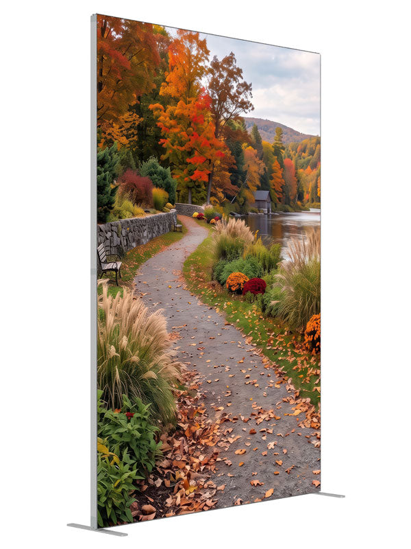 Curving riverside path along a low stone wall beneath peak autumn trees, 5ft photography backdrop panel for Denny StudioEdge silicone edge frame, angled view