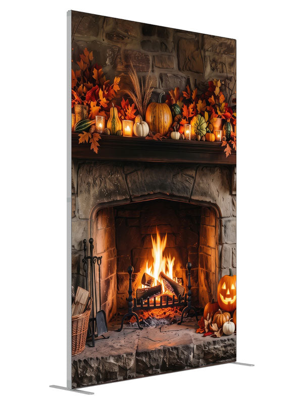 Rustic stone fireplace with a glowing fire and an autumn mantel of pumpkins and candles, 5ft photography backdrop panel for Denny StudioEdge silicone edge frame, angled view