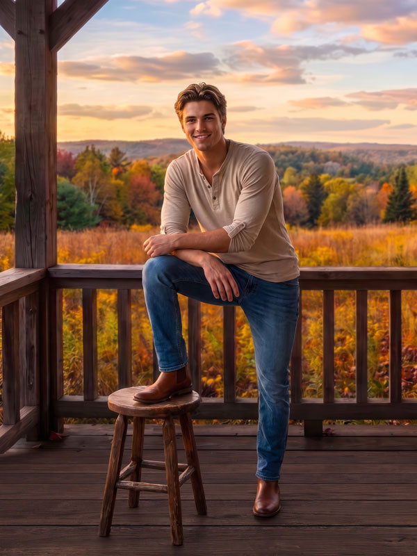 Autumn valley sunset porch view photography backdrop shown in a senior portrait with a young man resting a foot on a stool along the porch railing CP-9036