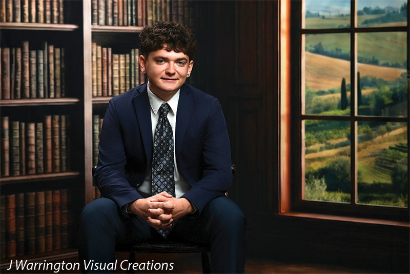 Benedict dark wood library bookcase photography backdrop shown with a senior in a navy suit seated by the arched window, wide view CP-8839