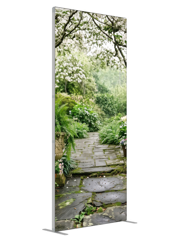 A stone garden path beneath blooming white dogwood trees with ferns, hostas and potted roses, 3ft photography backdrop panel for Denny StudioEdge silicone edge frame, angled view