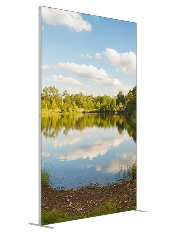 A calm lake mirroring a blue cloud-filled sky with a green tree line and grassy banks, 5ft photography backdrop panel for Denny StudioEdge silicone edge frame