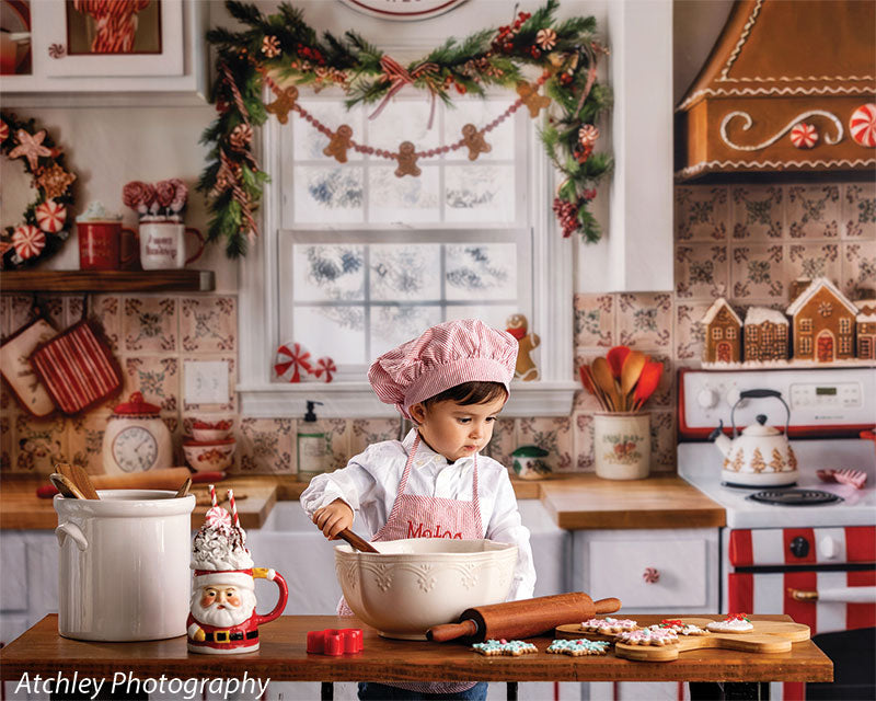 Candy Kitchen retro gingerbread kitchen photography backdrop shown with a young boy in a pink chef hat mixing in a bowl at the counter, wide view CP-8911